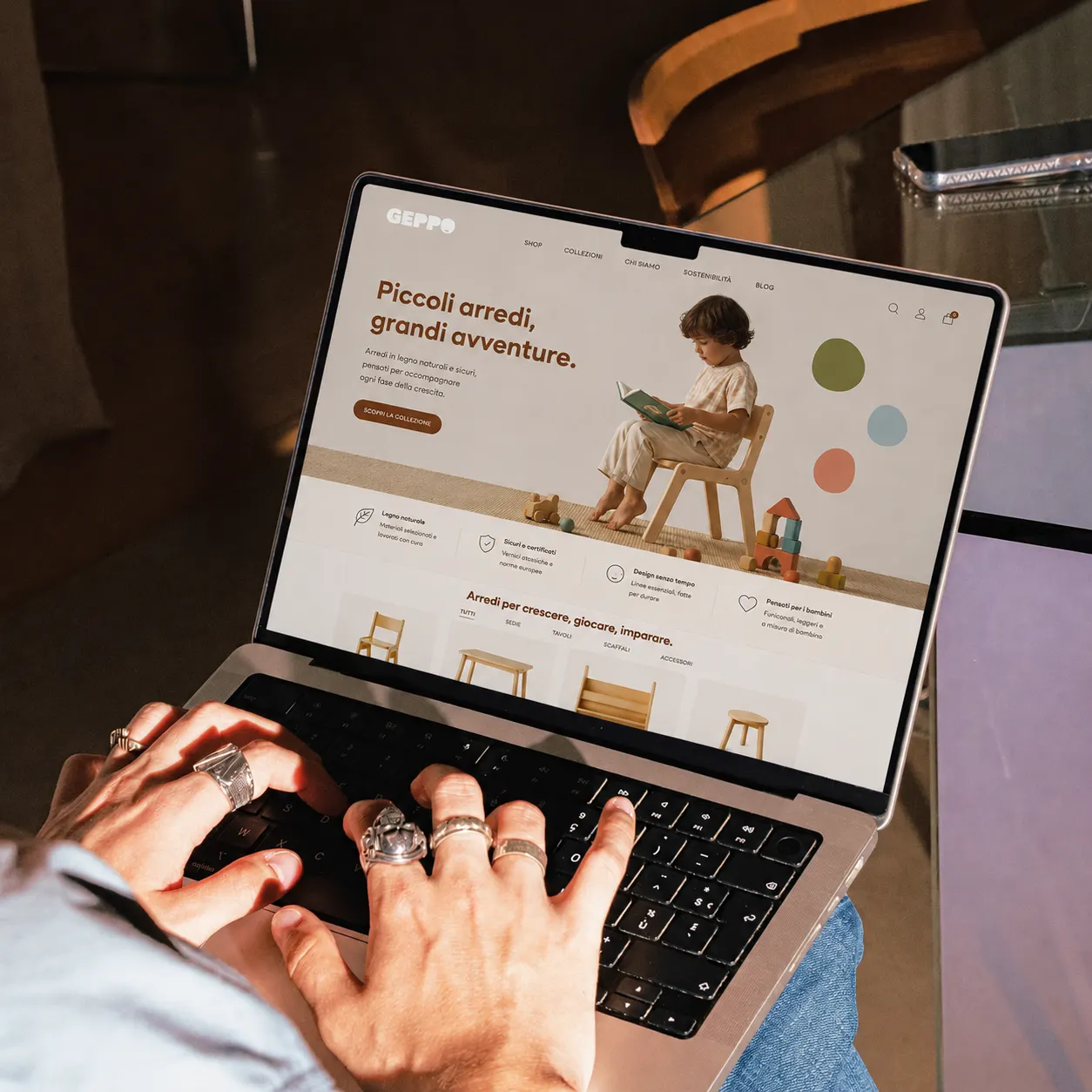 The brand website open on a laptop, small furniture section