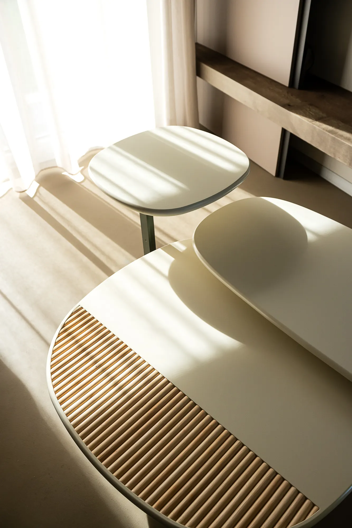 Cream curved seating with a ribbed woven detail