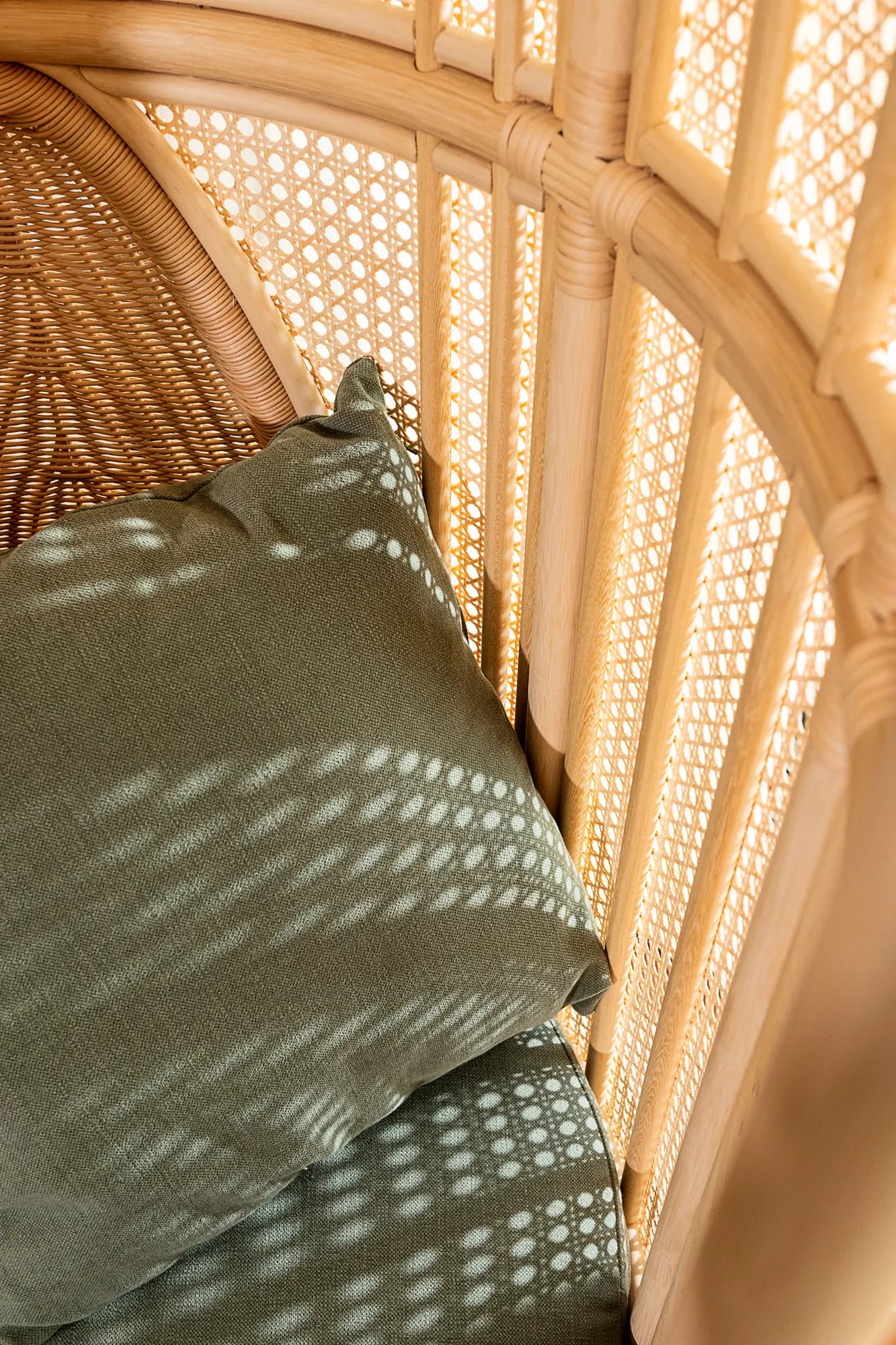Woven wicker basket on a concrete staircase against a dark brown wall