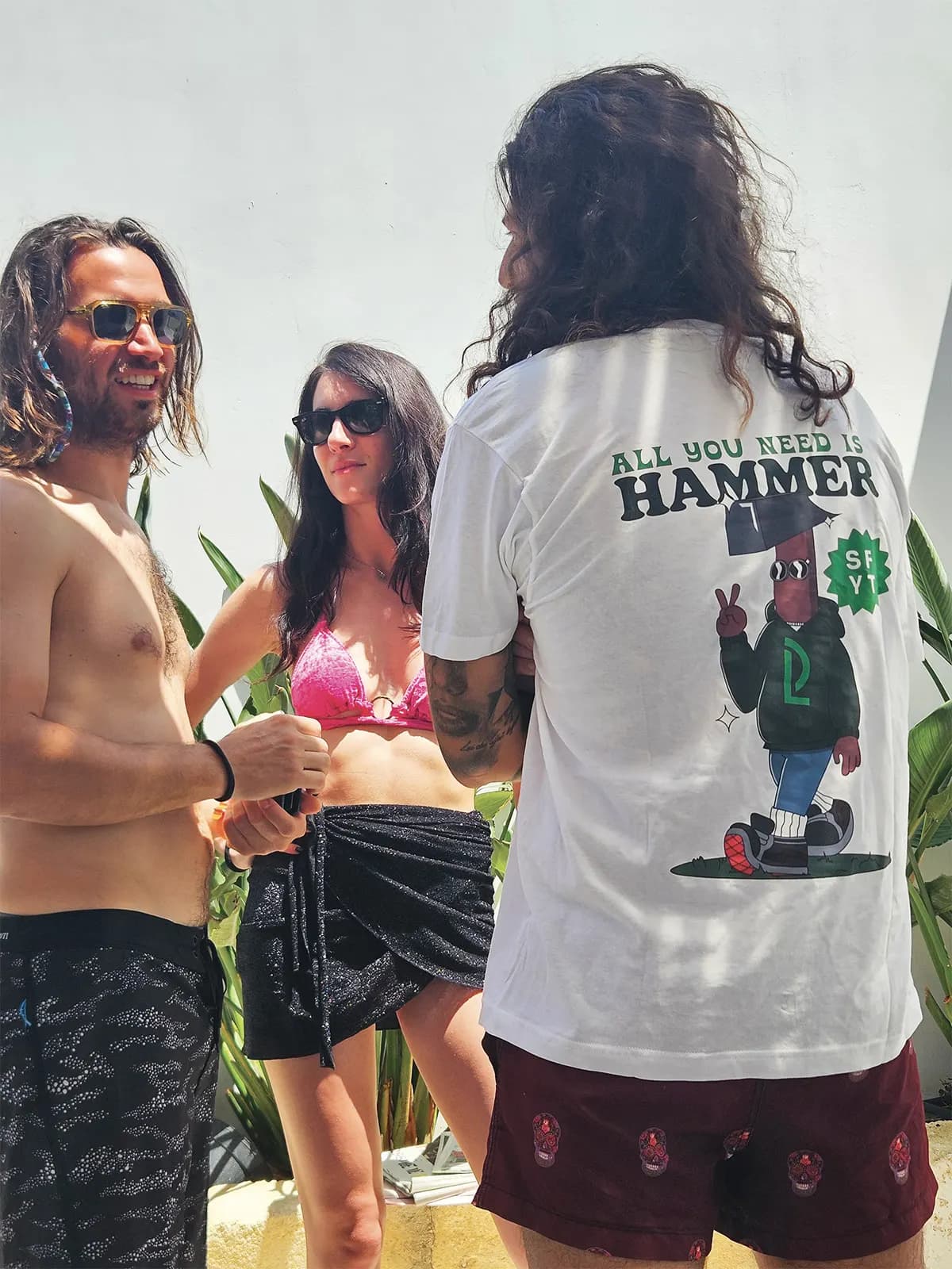 Project t-shirt worn on the beach, illustration on the back