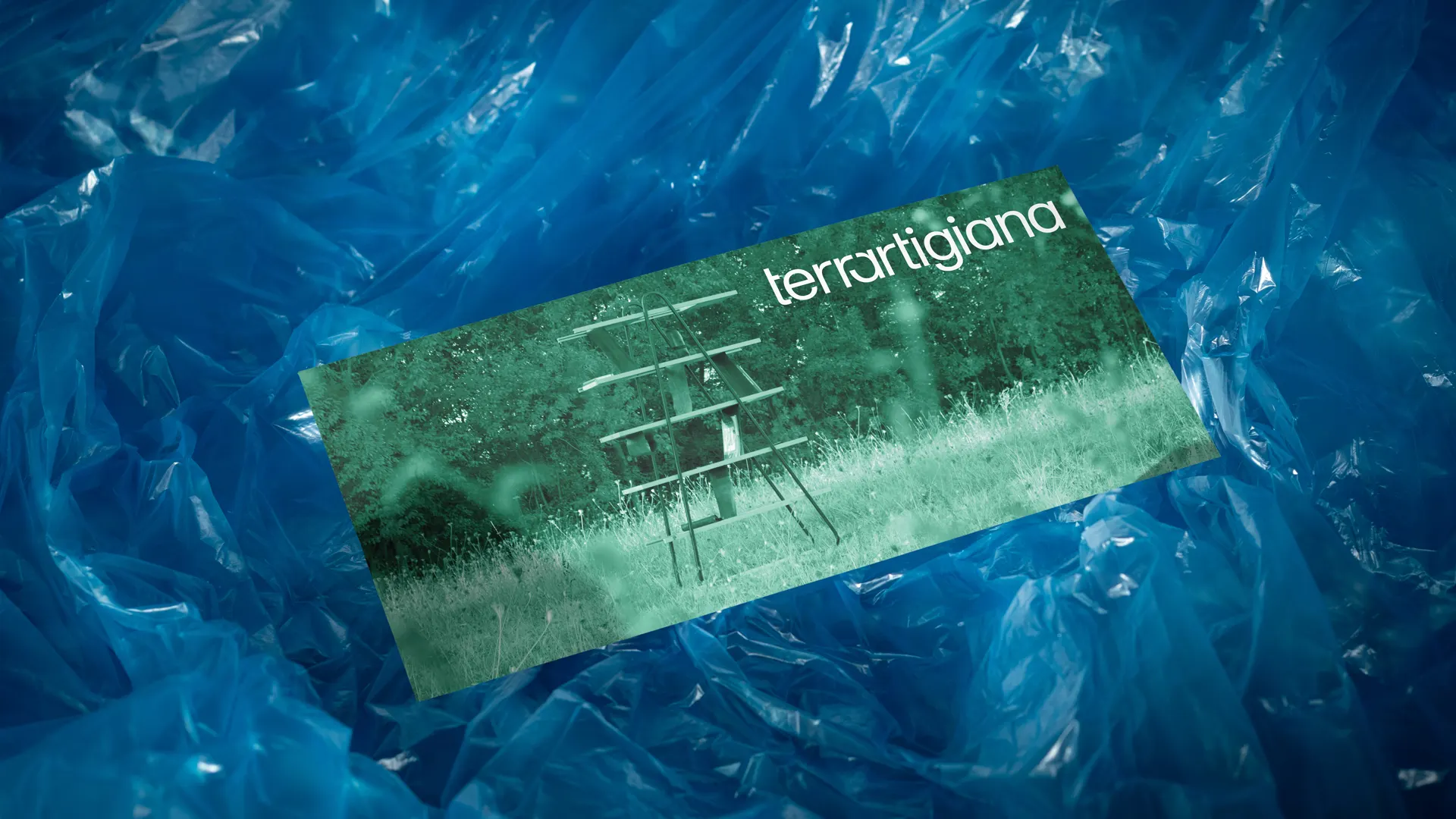 Brand card resting on blue plastic sheeting